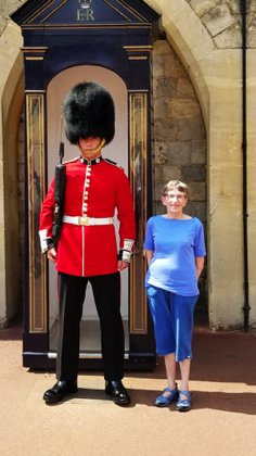 The guard is only taller because of his hat...bloody cheater.