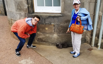 Justin and Katie with a one of the Queen's cats.
